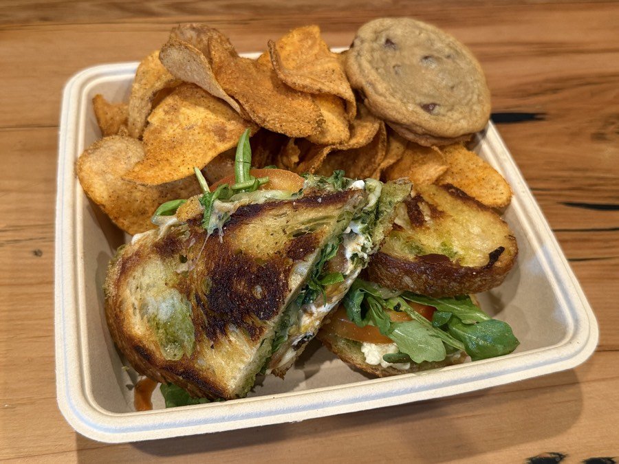 Pesto Melt sandwich boxed for catering